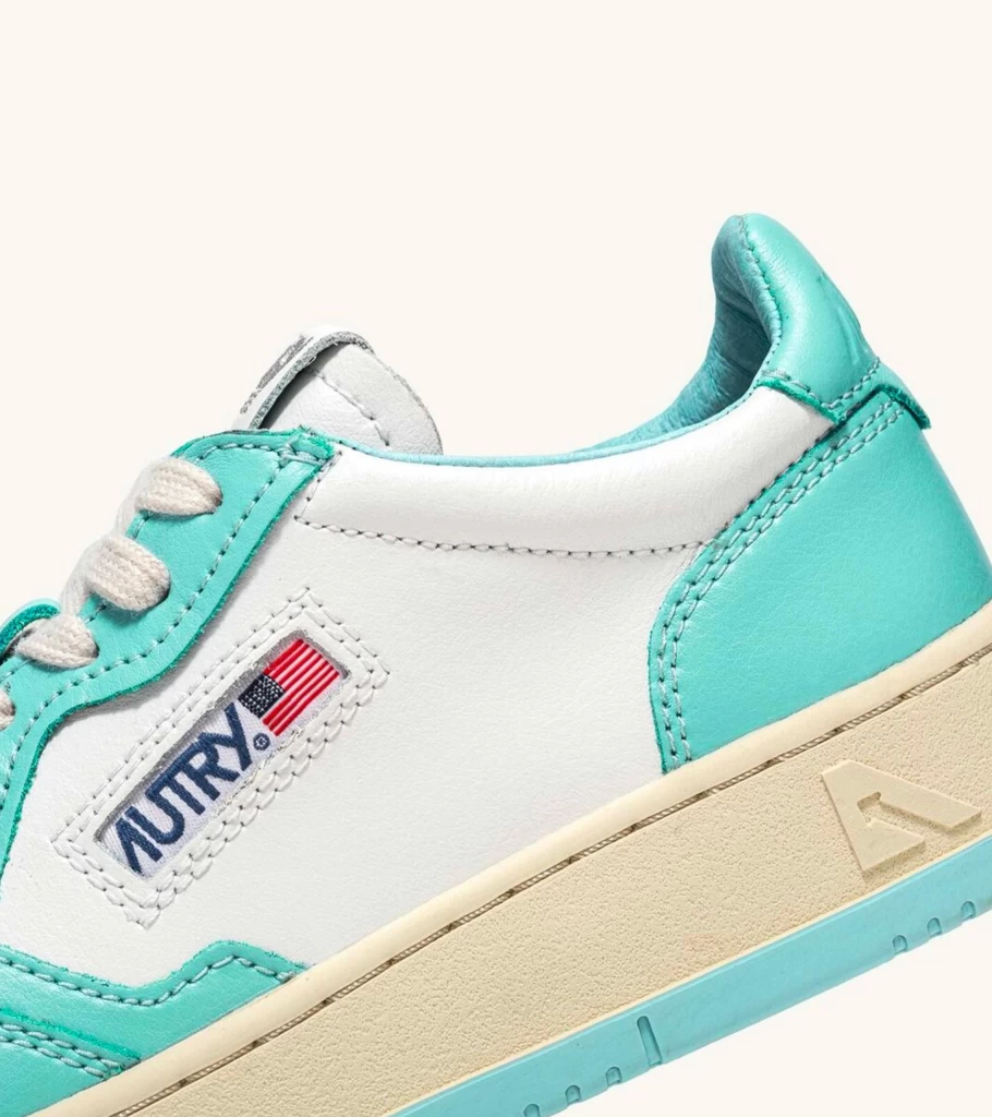 AUTRY Medalist Low Top Sneakers in White and Turquoise Two-Tone Leather
